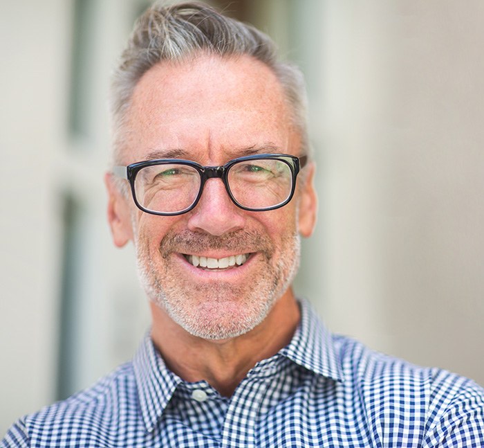 Smiling older man with glasses