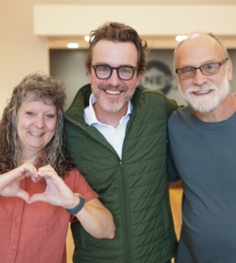 Patients and doctor smiling