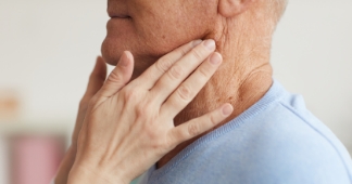 Oral surgeon examining a patients mouth