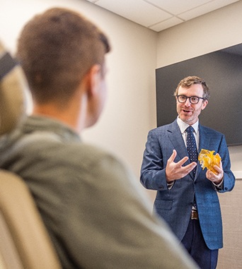 Oral surgeon and patient talking during consultation